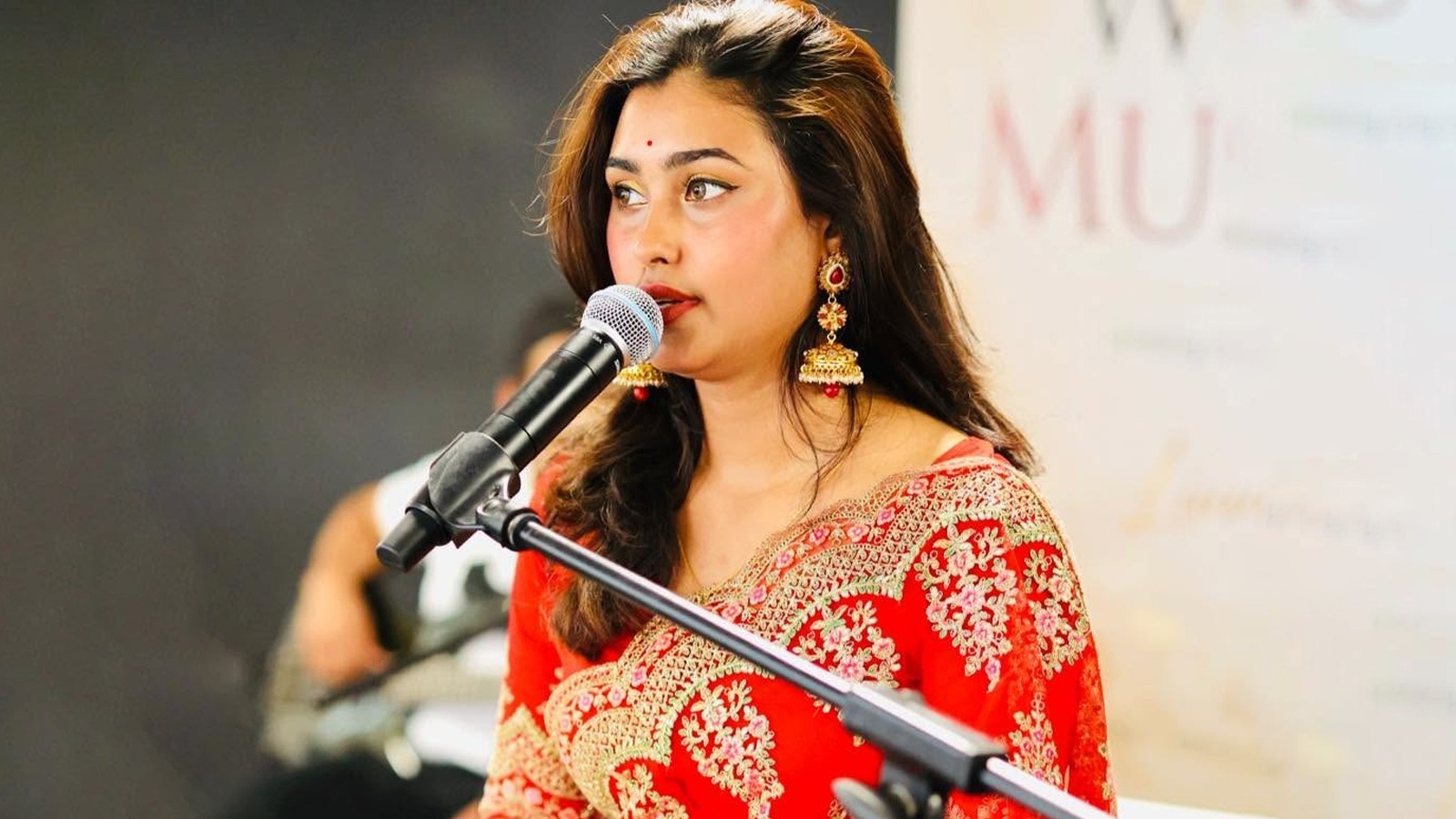 Jaya Barman singing on stage